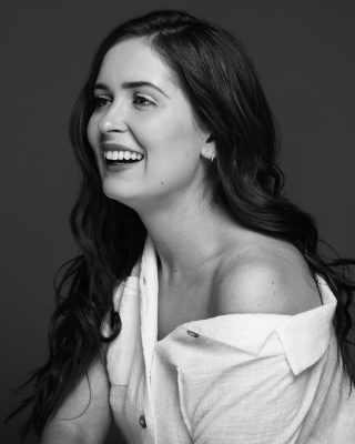 Fine art portrait of redhead woman laughing in Melbourne portrait studio