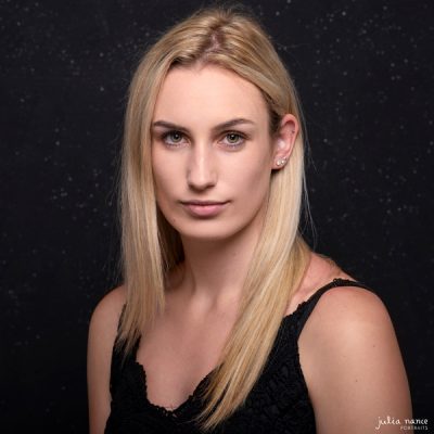 Fine art portrait of woman on black background in Melbourne portrait studio.
